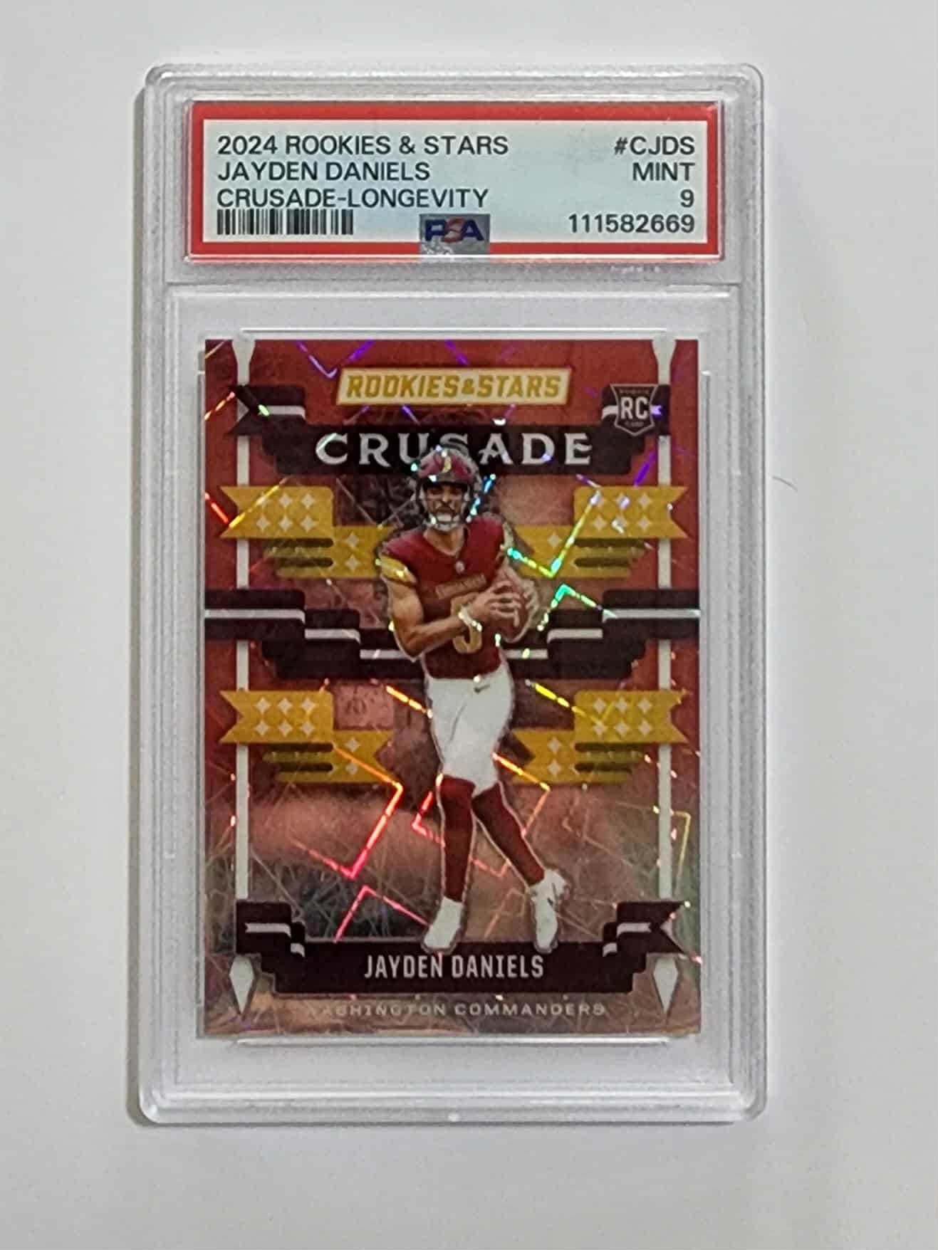 2024 ROOKIES & STARS #CJDS JAYDEN DANIELS (RC) CRUSADE LONGEVITY PSA 9